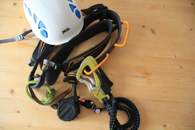 A basic via ferrata kit including a lanyard, helmet and harness